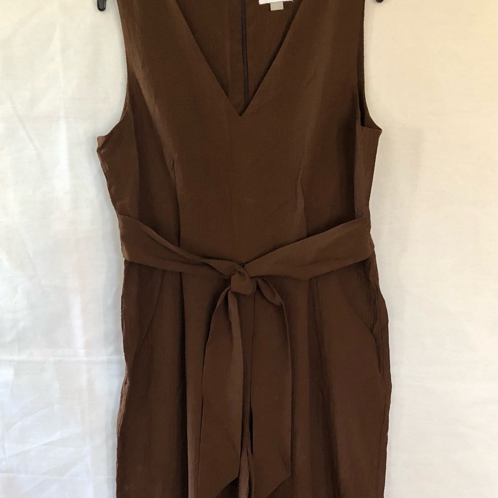 Calvin Klein sleeveless jumpsuit with self belt.